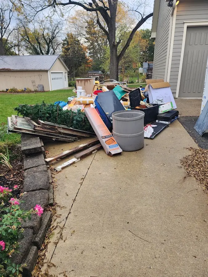 Dumpster being loaded with debris for 30 Yard Dumpster Rental in Pembroke